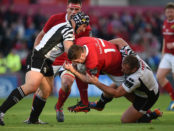 Limerick , Ireland - 1 October 2016; James Cronin of Munster is tackled by Carlo Festuccia, left, and Andrea Lovotti of Zebre during the Guinness PRO12 Round 5 match between Munster and Zebre at Thomond Park in Limerick. (Photo By Diarmuid Greene/Sportsfile via Getty Images)